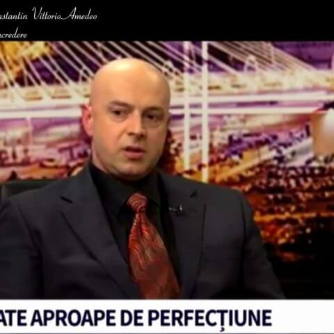 Interview setting with city backdrop.